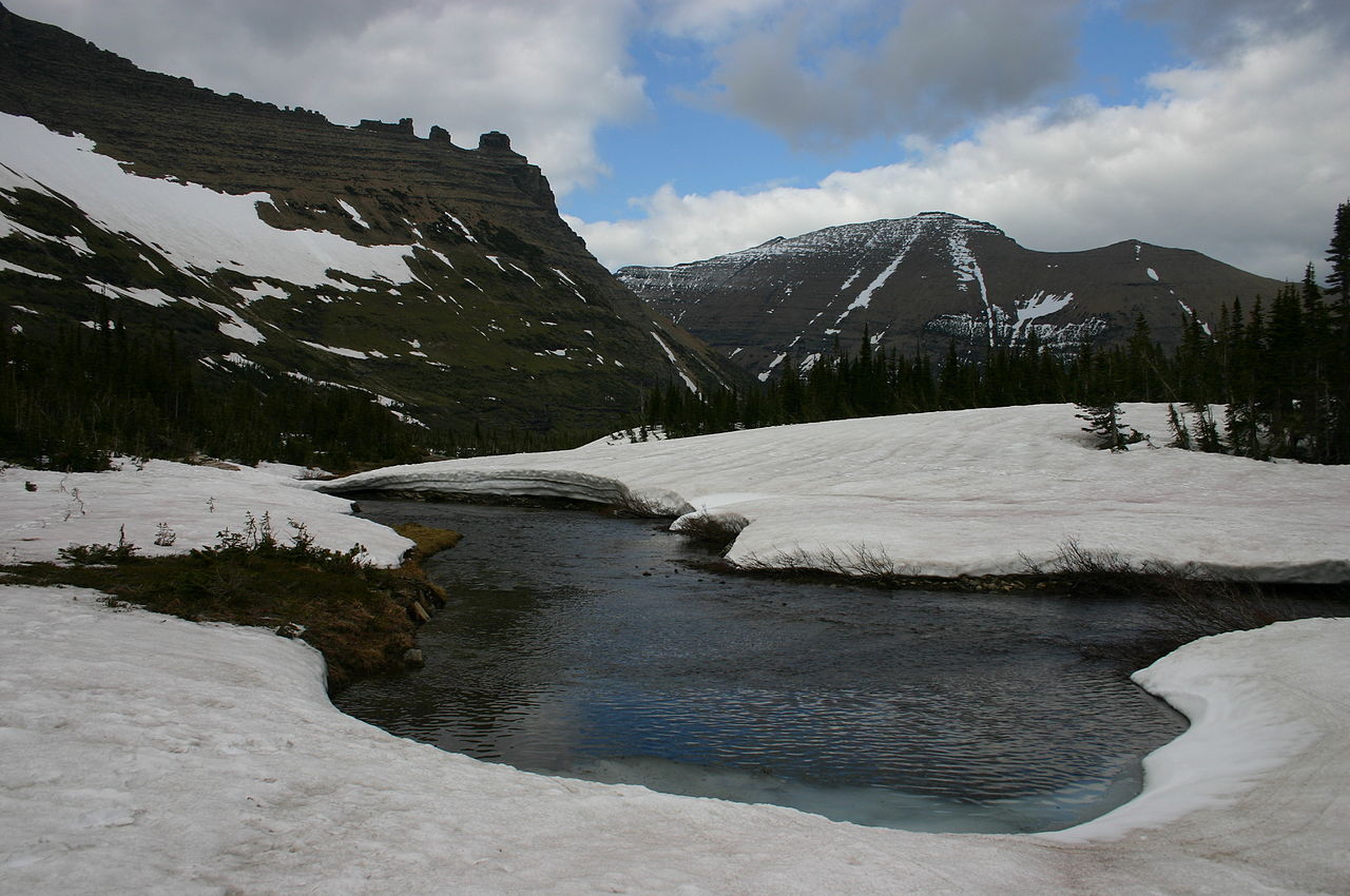 1280px-Snow_Melts_into_River_near_Iceberg_Lake_in_Glacier_National_Park_1